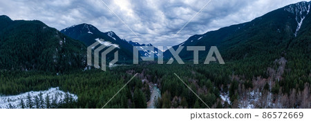 Aerial Panoramic View from above of Canadian Nature Valley around Mountains. Aerial Panoramic View from above of Canadian Nature Valley around Mountains. 86572669