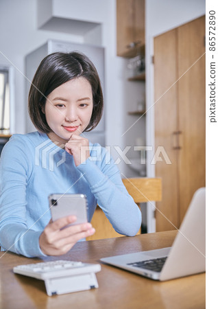 Young woman thinking about asset management Young woman thinking about asset management 86572890