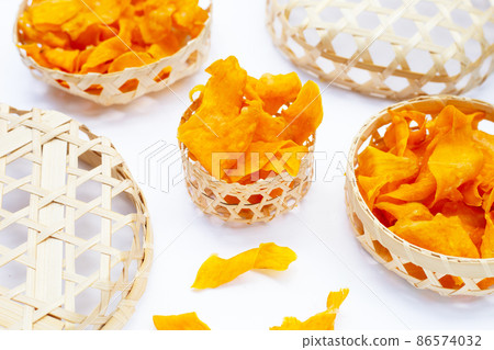 Sweet potato chips on white background. 86574032