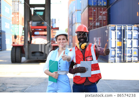engineer working in container area logistics transportation import export or shipping industry , delivery and logistics concept container truck transport or free-zone area engineer working in container area logistics transportation import export or shipping industry , delivery and logistics concept container truck transport or free-zone area 86574238