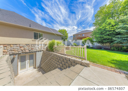 Basement entrance with glass panels on the double doors 86574807