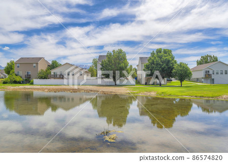 Shallow lake in a residential community at Utah valley 86574820