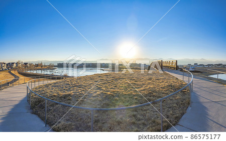 Curved pathway metal barriers near the bridge over the Oquirrh lake at Daybreak, South Jordan, Utah 86575177