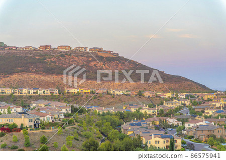 Houses on top and at the bottom of a hill at San Diego, California Houses on top and at the bottom of a hill at San Diego, California 86575941