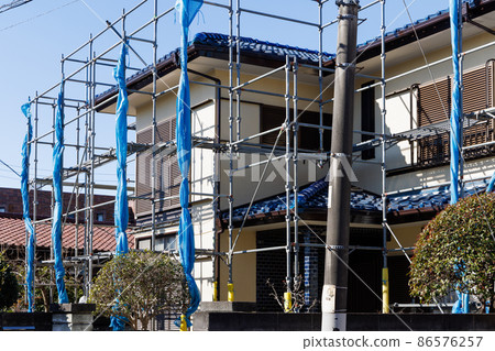 Scaffolding for painting the exterior walls of houses 86576257