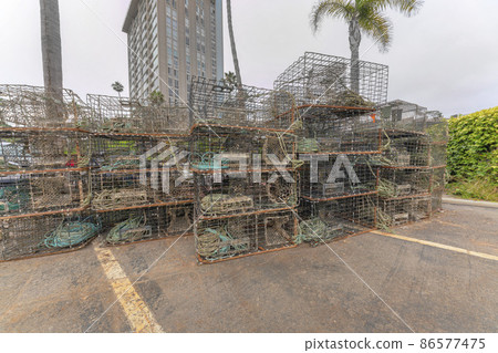 Stack of fishing traps in a parking lot at Oceanside, California 86577475
