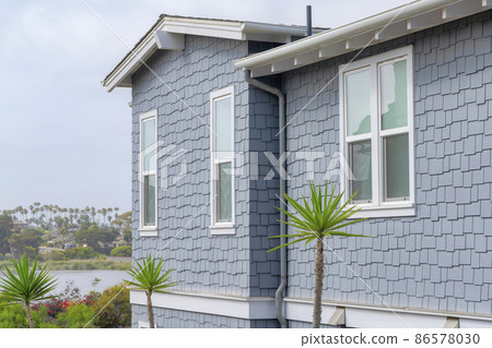 Side view of a house with light gray shingles sidings at La Jolla, California Side view of a house with light gray shingles sidings at La Jolla, California 86578030