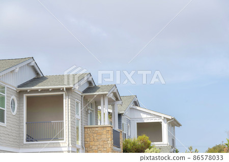 Low angle view of houses with shingle sidings and balcony at La Jolla, California 86578033