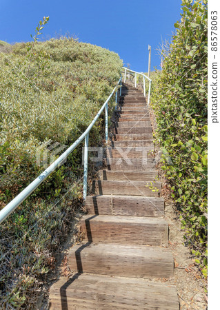 Uphill trail with wooden steps at San Clemente, California Uphill trail with wooden steps at San Clemente, California 86578063