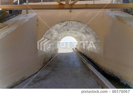 Arched underpass leading to a beach at San Clemente, California 86578067