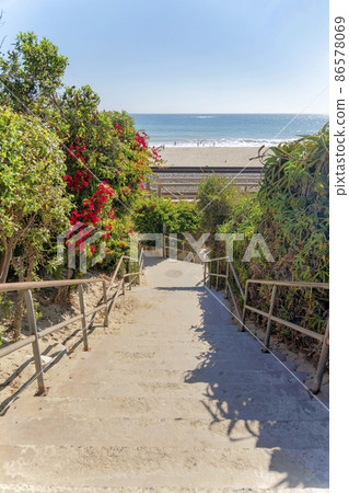 Concrete stairs wih metal handrails on a beach at San Clemente, California 86578069