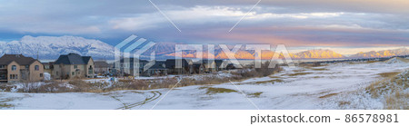Snow covered field outside the residential area at Saratoga Springs in Utah 86578981