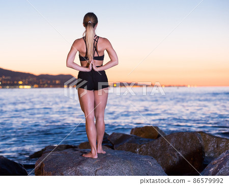 Female is practicing stretching Female is practicing stretching 86579992
