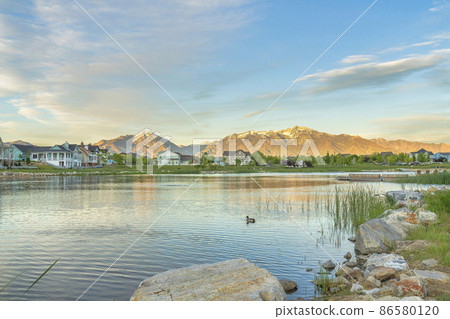 Oquirrh Lake at Daybreak, Utah with a view of mountain range at the back Oquirrh Lake at Daybreak, Utah with a view of mountain range at the back 86580120