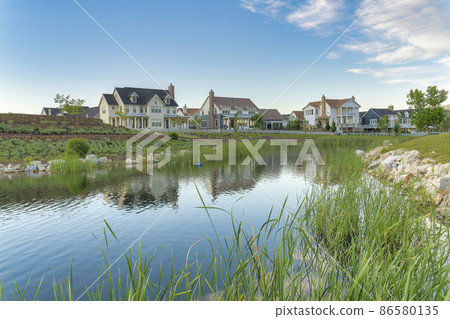 Oquirrh Lake with a reflection of the residential houses at Daybreak, Utah 86580135