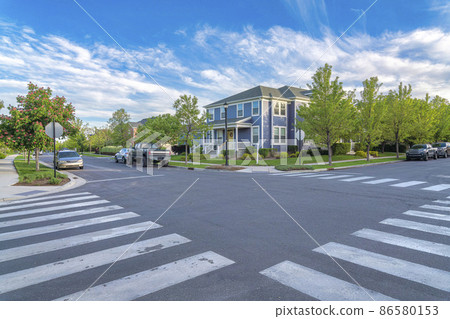 Crosswalk at the intersection road in a residential area at Daybreak, Utah Crosswalk at the intersection road in a residential area at Daybreak, Utah 86580153