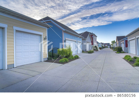 Exterior of garages across each other in a residential area at Daybreak, Utah Exterior of garages across each other in a residential area at Daybreak, Utah 86580156