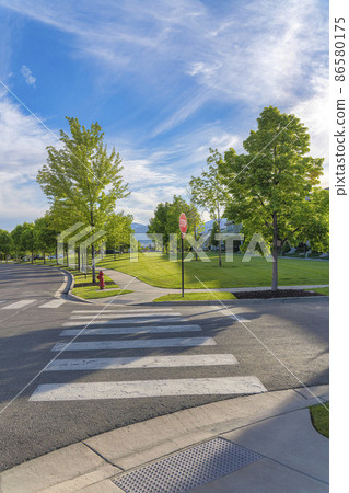 Crosswalk lanes at the intersection near the residential area at Daybreak, Utah 86580175