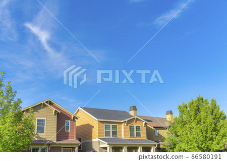 Home exterior with colorful shingles siding at Daybreak, Utah Home exterior with colorful shingles siding at Daybreak, Utah 86580191