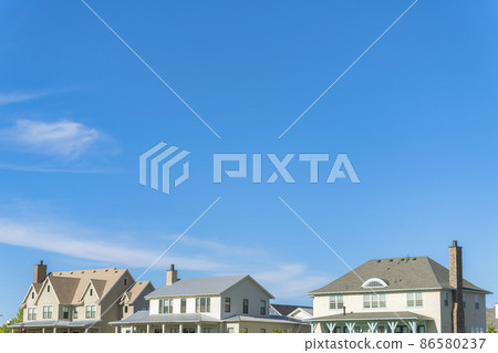 Second floor exterior of two-storey houses with different roof structures at Daybreak, Utah 86580237