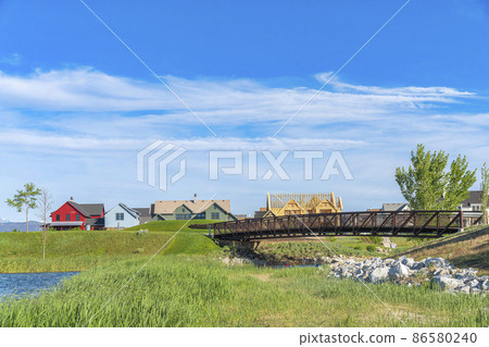 Arched bridge over the Oquirrh Lake at Daybreak, Utah 86580240