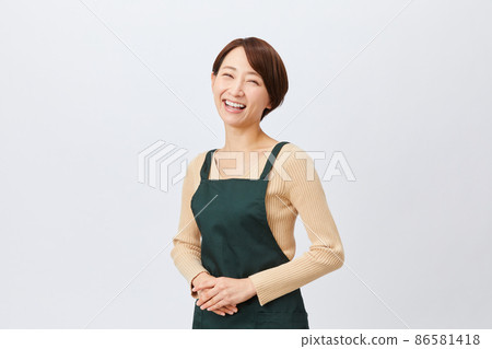 Female staff in an apron clerk Female staff in an apron clerk 86581418