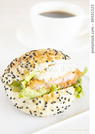 Delicious shrimp cutlet sandwich and hot coffee Delicious shrimp cutlet sandwich and hot coffee 86581523
