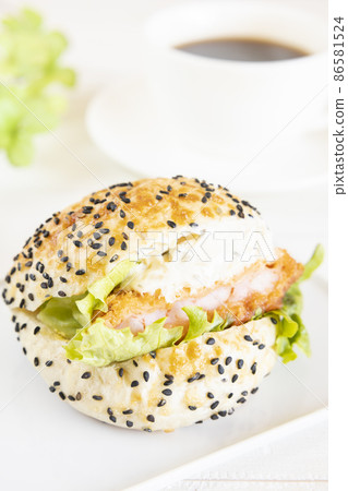 Delicious shrimp cutlet sandwich and hot coffee 86581524