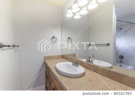 Bathroom interior with vanity sink and towel bar holder 86581765