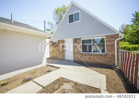 Guest house exterior with vinyl wood and bricks siding Guest house exterior with vinyl wood and bricks siding 86582051