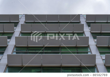 Facade of a building with white sunshade panels at Salt Lake City in Utah Facade of a building with white sunshade panels at Salt Lake City in Utah 86582769