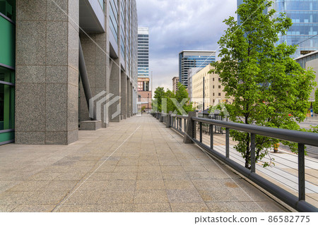 Deck with granite flooring and cable railings at the front of the building in Salt Lake City, Utah 86582775