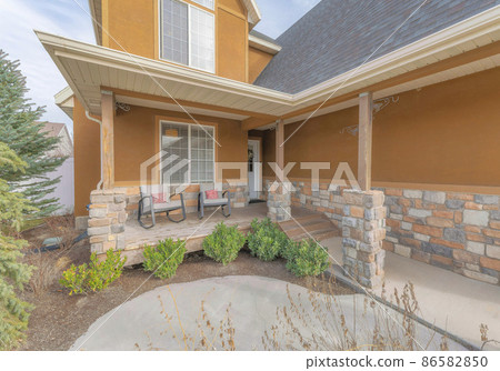 Orange tan house exterior with stone veneer sidings Orange tan house exterior with stone veneer sidings 86582850