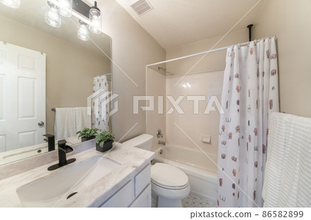 Small modern traditional bathroom interior with tub-shower combo kit Small modern traditional bathroom interior with tub-shower combo kit 86582899