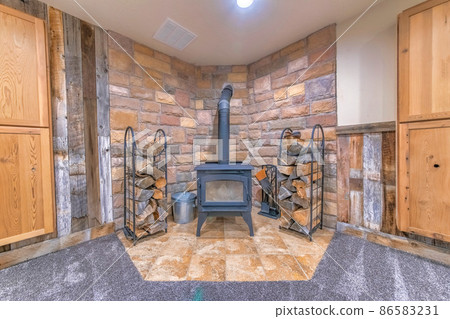 Interior of a fireplace with vintage wood burning stove Interior of a fireplace with vintage wood burning stove 86583231