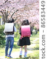 Two elementary school boys and girls wearing school bags 86583449