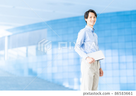 A businessman standing in the aisle A businessman standing in the aisle 86583661