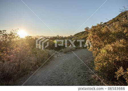 Rough hiking trail in the middle of shrubs and bushes at Draper, Utah 86583666