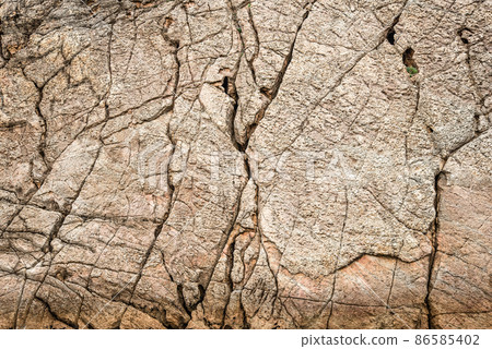 Dry gray cracked surface of stone ground Dry gray cracked surface of stone ground 86585402