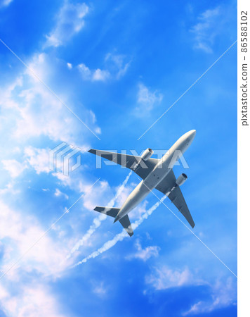 Vertical nature background with aircraft and Jet trailing smoke in the sky. Airplane and condensation trail 86588102
