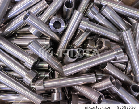 pile of shiny steel tubes after cnc turning operations - abstract full frame indistrial background 86588536