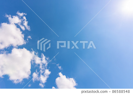 Clouds are white in the clear sky opposite the sun. Clouds are white in the clear sky opposite the sun. 86588548