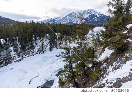 Superb view of Banff National Park in winter Bow River, Bow Falls Canada Canadian Rockies Superb view of Banff National Park in winter Bow River, Bow Falls Canada Canadian Rockies 86588626