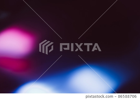 Blur glow overlay. Neon flash light. Ultraviolet radiance flare filter. Defocused uv led pink blue color flecks on dark black abstract background. Blur glow overlay. Neon flash light. Ultraviolet radiance flare filter. Defocused uv led pink blue color flecks on dark black abstract background. 86588706