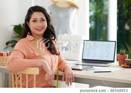 Smiling Tailor in Her Home Office Smiling Tailor in Her Home Office 86588953