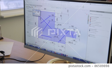 A close-up of a computer showing a drawing of a room on the screen. Building A close-up of a computer showing a drawing of a room on the screen. Building 86589898