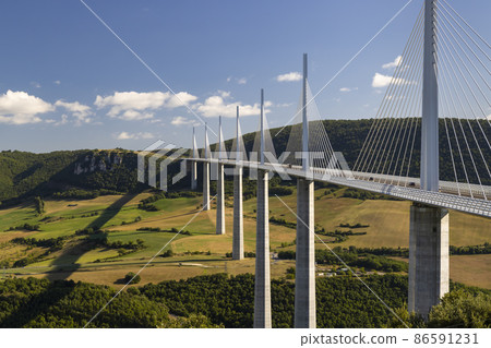 Multi-span cable stayed Millau Viaduct across gorge valley of Tarn River, Aveyron Departement, France 86591231