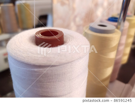 Bobbin of thread sewing workshop. Handmade tailor. 86591245