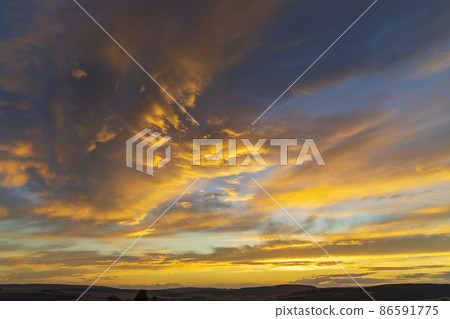 sunset in late summer with colorful clouds sunset in late summer with colorful clouds 86591775