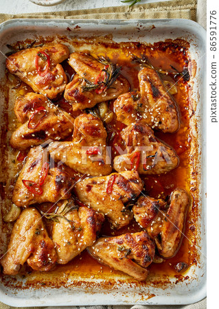 Barbecue chicken wings. Sticky asian spicy wings with teriyaki. ven baked marinated chiken 86591776